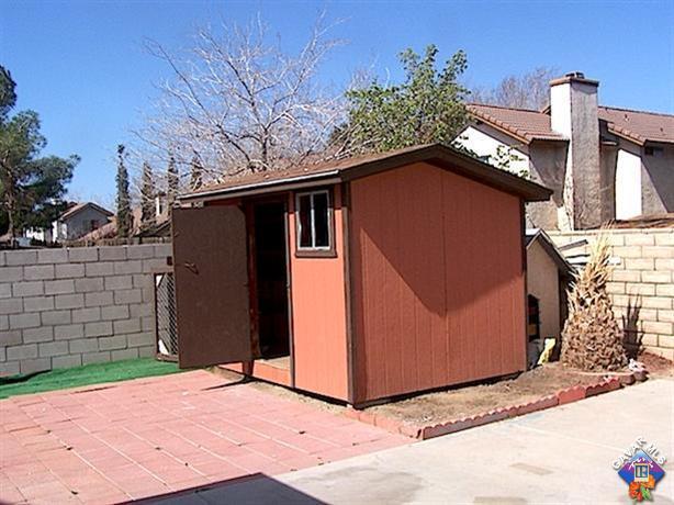 1241 Kings Road Palmdale, CA 93551 - Photo 21 of 21 a backyard of a house with lots of green space