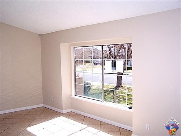 1241 Kings Road Palmdale, CA 93551 - Photo 3 of 21 a view of an empty room with a window