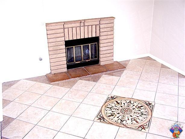 1241 Kings Road Palmdale, CA 93551 - Photo 6 of 21 a living room with a rug