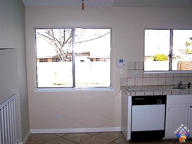 1241 Kings Road Palmdale, CA 93551 - Photo 9 of 21 a bathroom with a window sink and a mirror