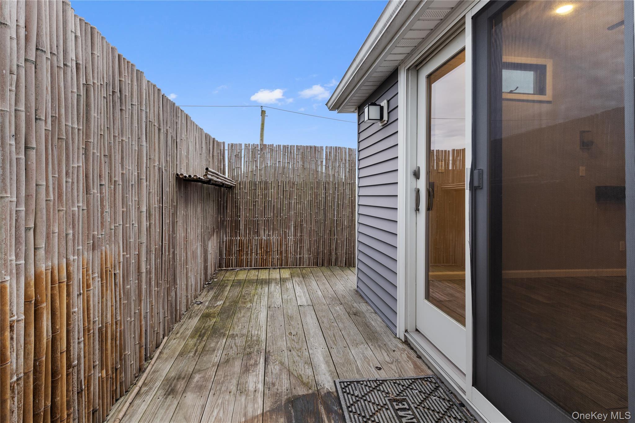 33 Kent Road Island Park, NY 11558 - Photo 14 of 26 a view of a wooden door with a balcony