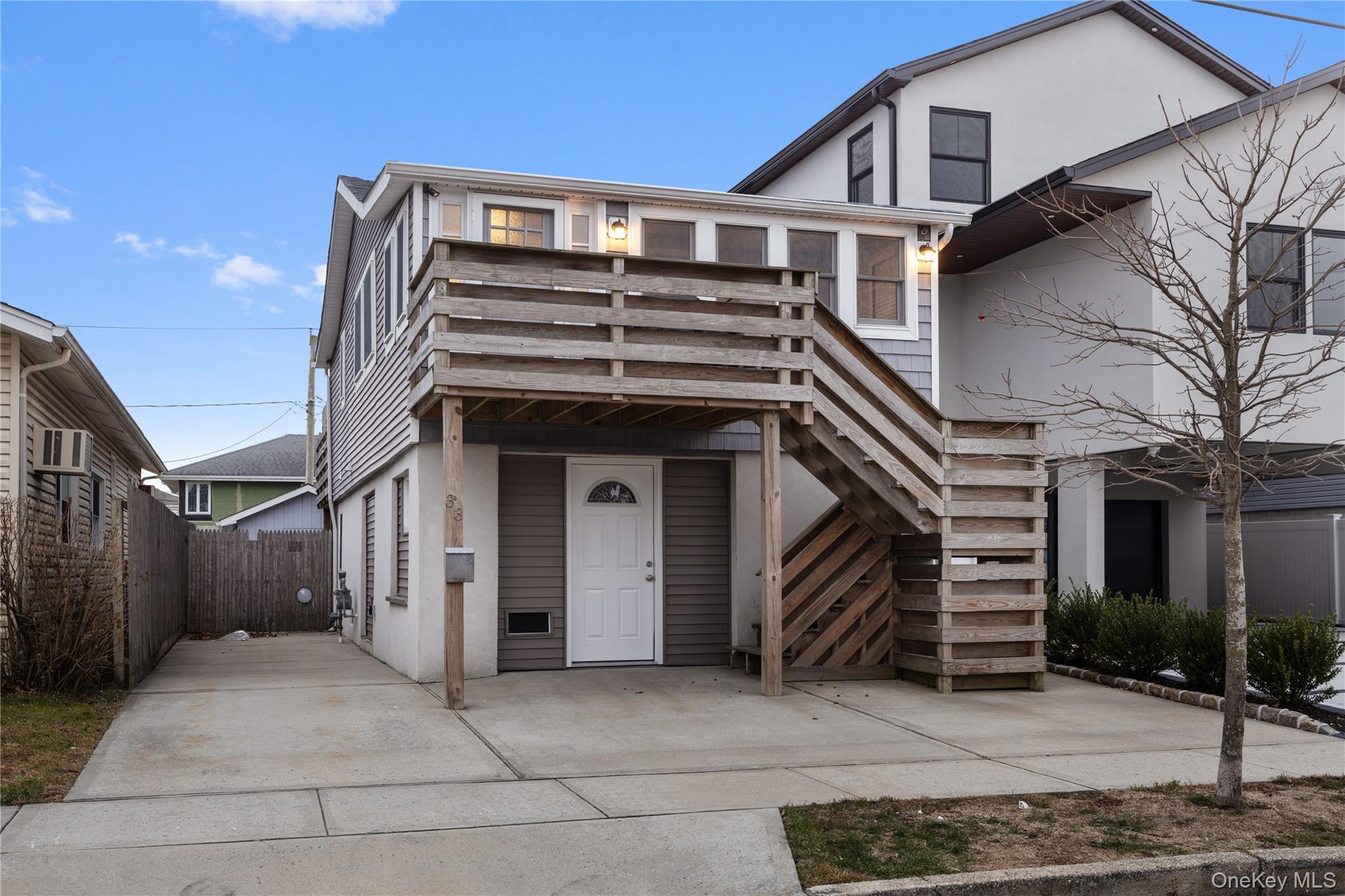 33 Kent Road Island Park, NY 11558 - Photo 22 of 26 a front view of a house with a garage