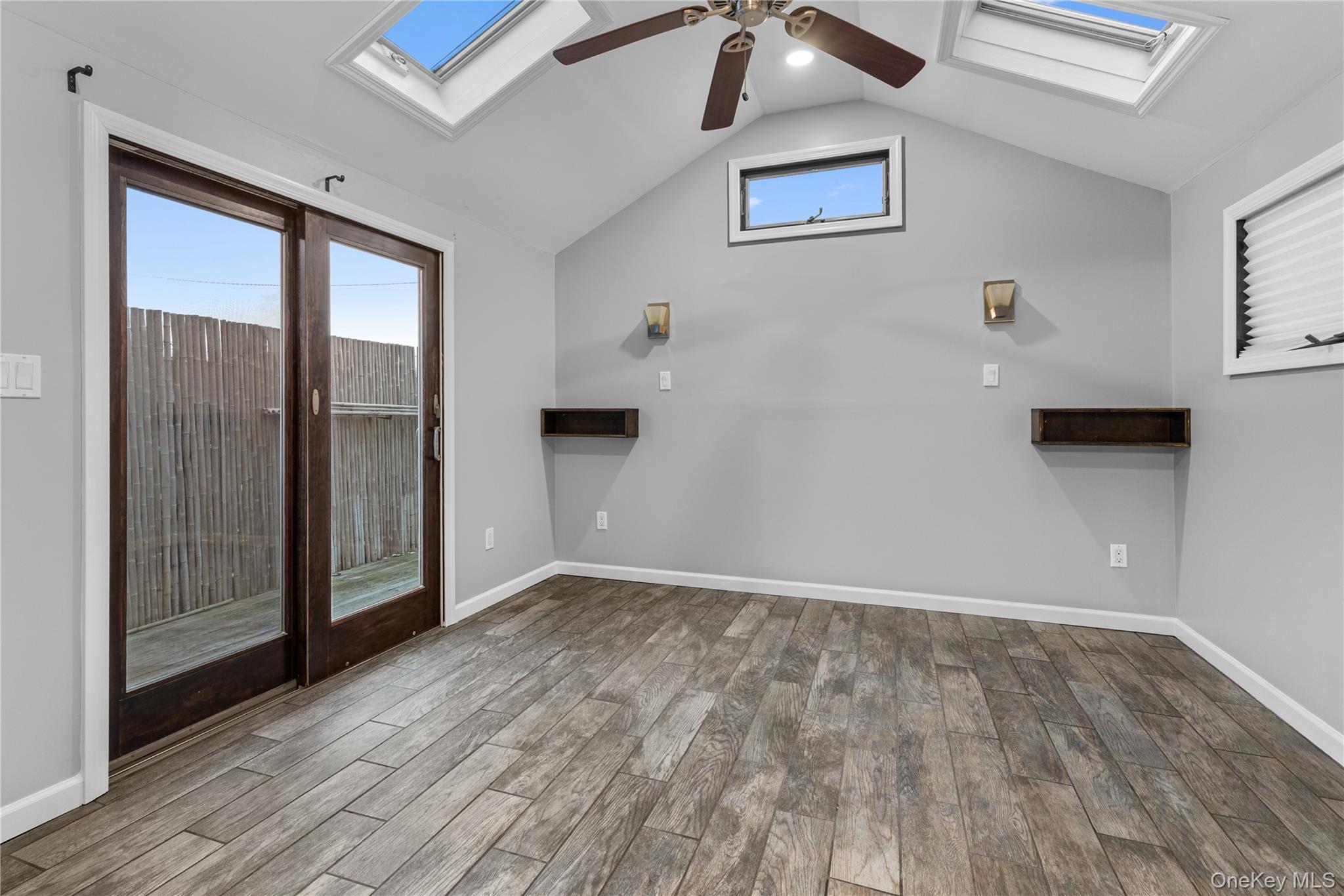 33 Kent Road Island Park, NY 11558 - Photo 8 of 26 a view of an empty room with wooden floor and a window