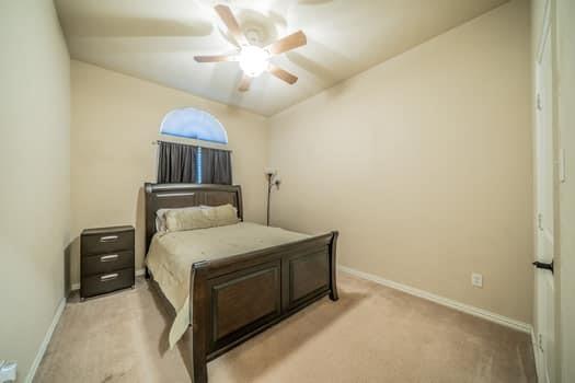 166 Oxford Ranch Road Waxahachie, TX 75167 - Photo 14 of 27 Arched window, vaulted ceiling, ceiling fan, and carpeted flooring