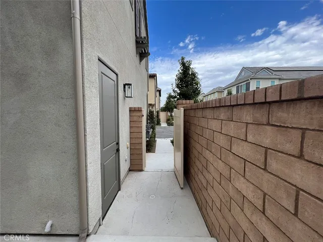 a street view with couple of cars parked in front of it