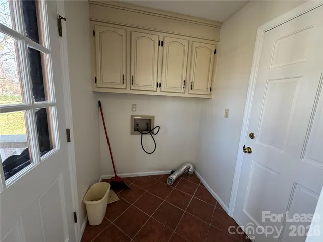 a bathroom with a sink a toilet and a window