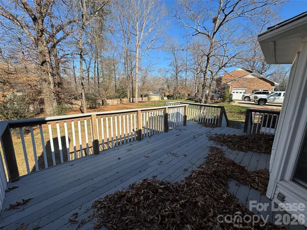 a view of house with deck and outdoor seating