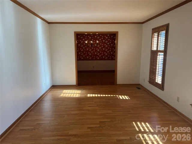 a view of an empty room and window