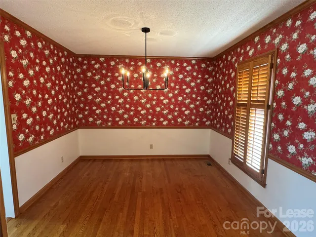 a view of wooden floor with a window