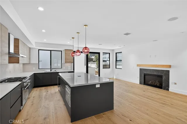 a kitchen with a sink and a stove top oven