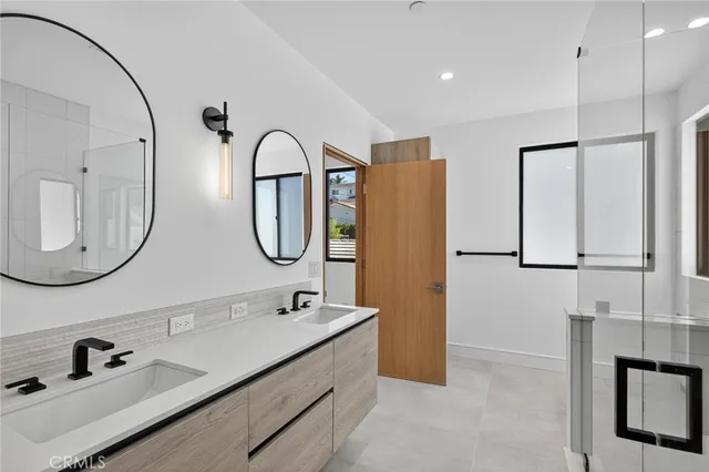 a bathroom with a double vanity sink double vanity and a mirror