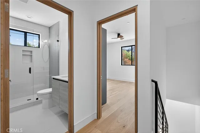 a view of a bathroom from a hallway