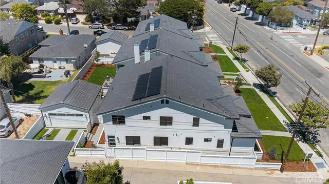 a aerial view of a house with a yard