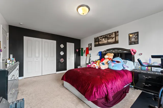 a bedroom with bed and a window