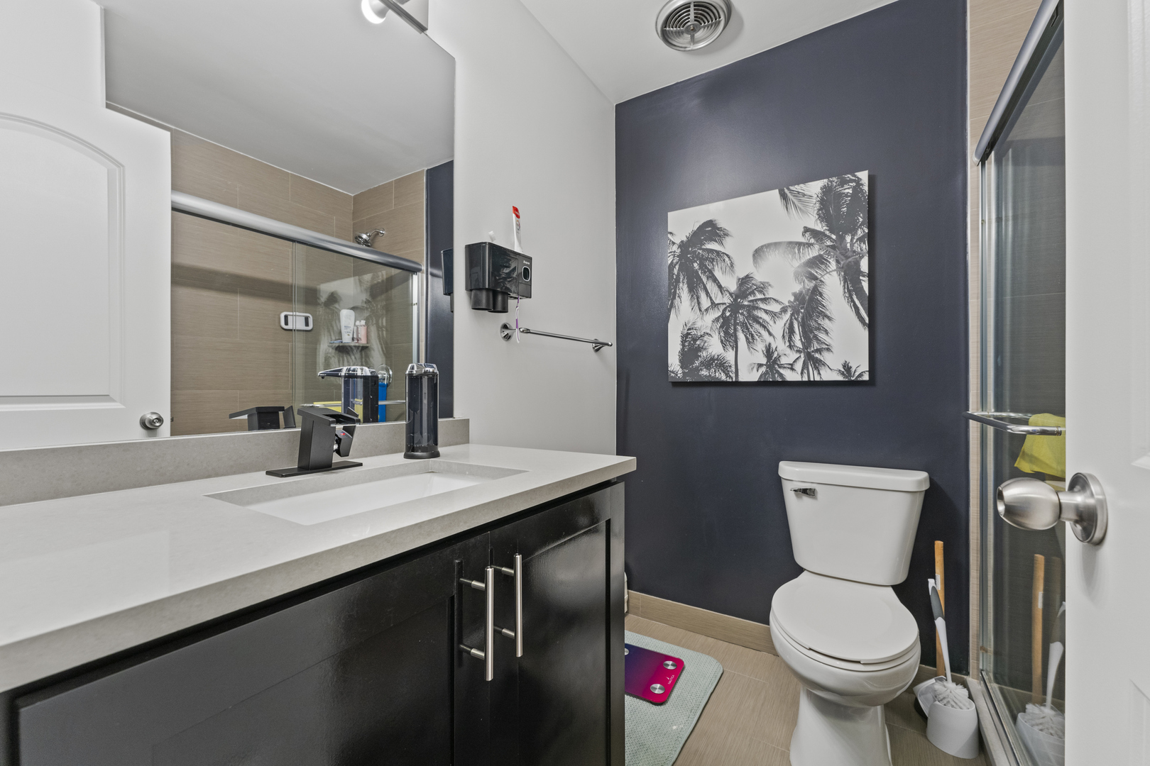 4623 North Chester Avenue, Unit 410 Chicago, IL 60656 - Photo 17 of 20 a bathroom with a toilet sink and mirror