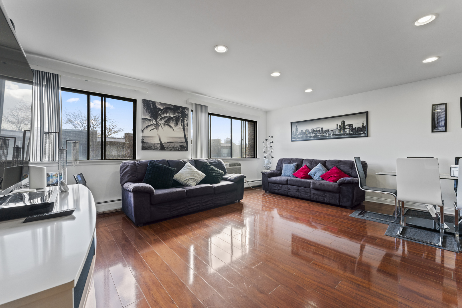 4623 North Chester Avenue, Unit 410 Chicago, IL 60656 - Photo 3 of 20 a living room with furniture window and a wooden floor