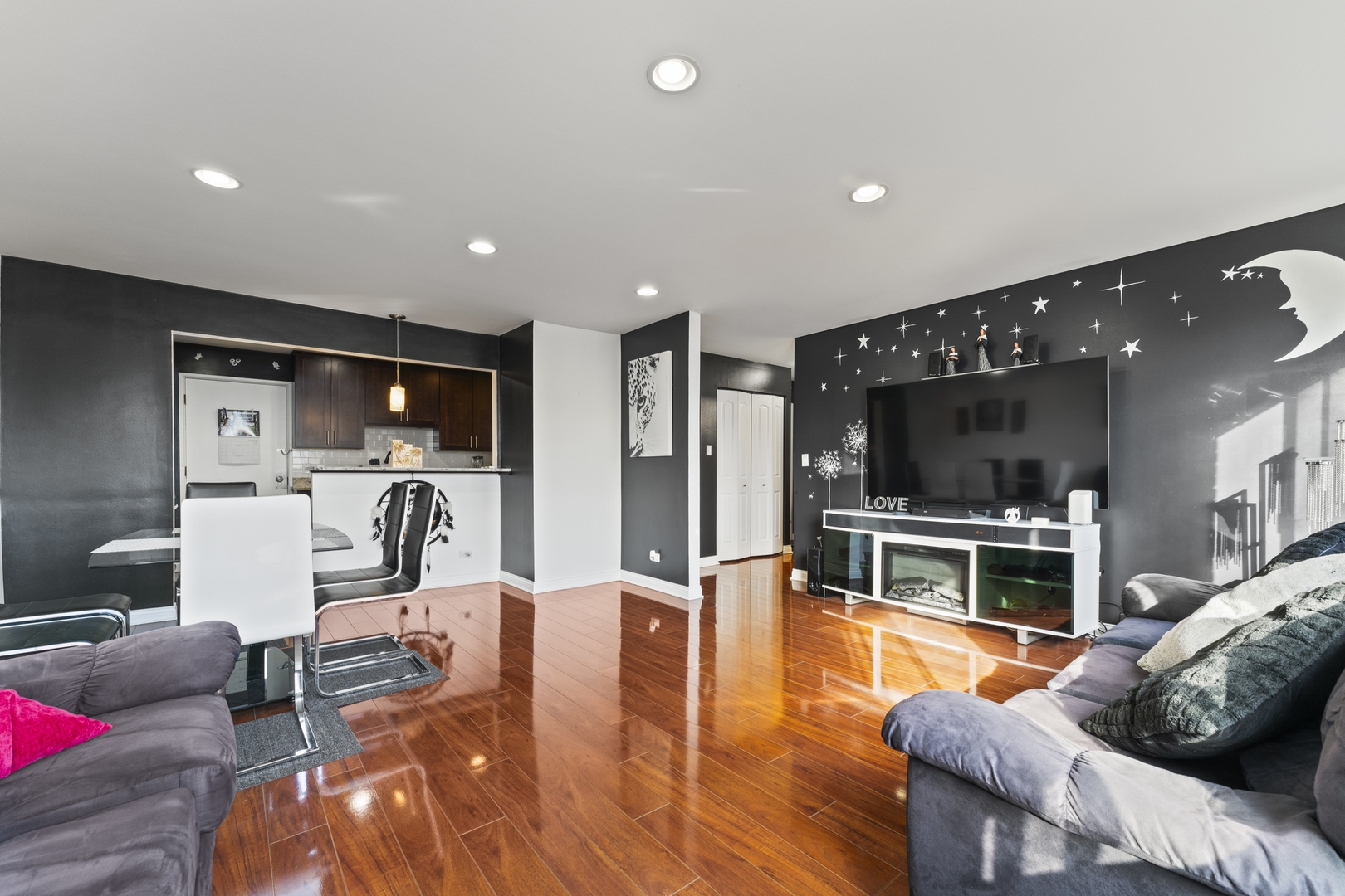 4623 North Chester Avenue, Unit 410 Chicago, IL 60656 - Photo 4 of 20 a living room with furniture and a flat screen tv