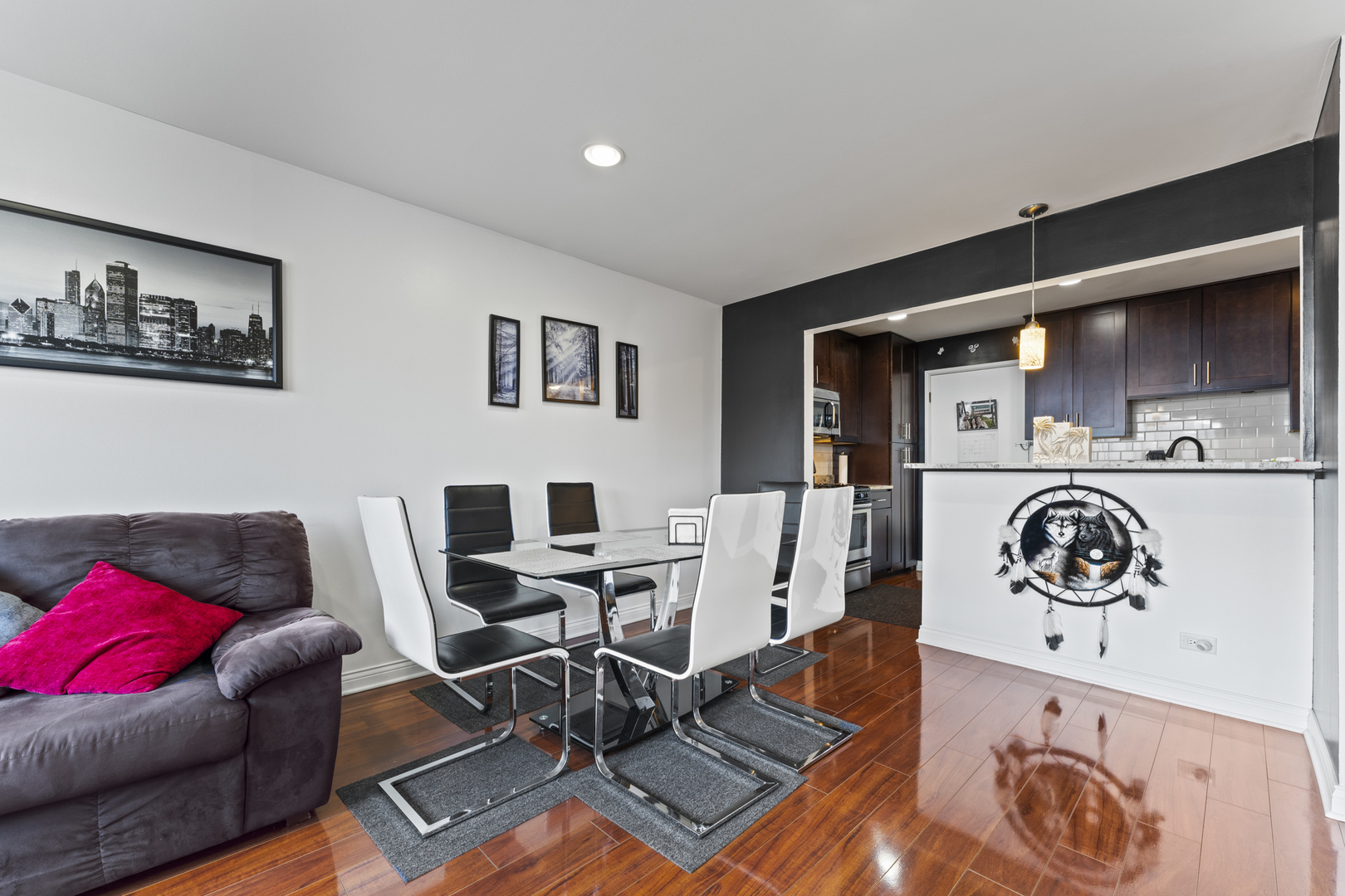 4623 North Chester Avenue, Unit 410 Chicago, IL 60656 - Photo 5 of 20 a living room with furniture and a flat screen tv