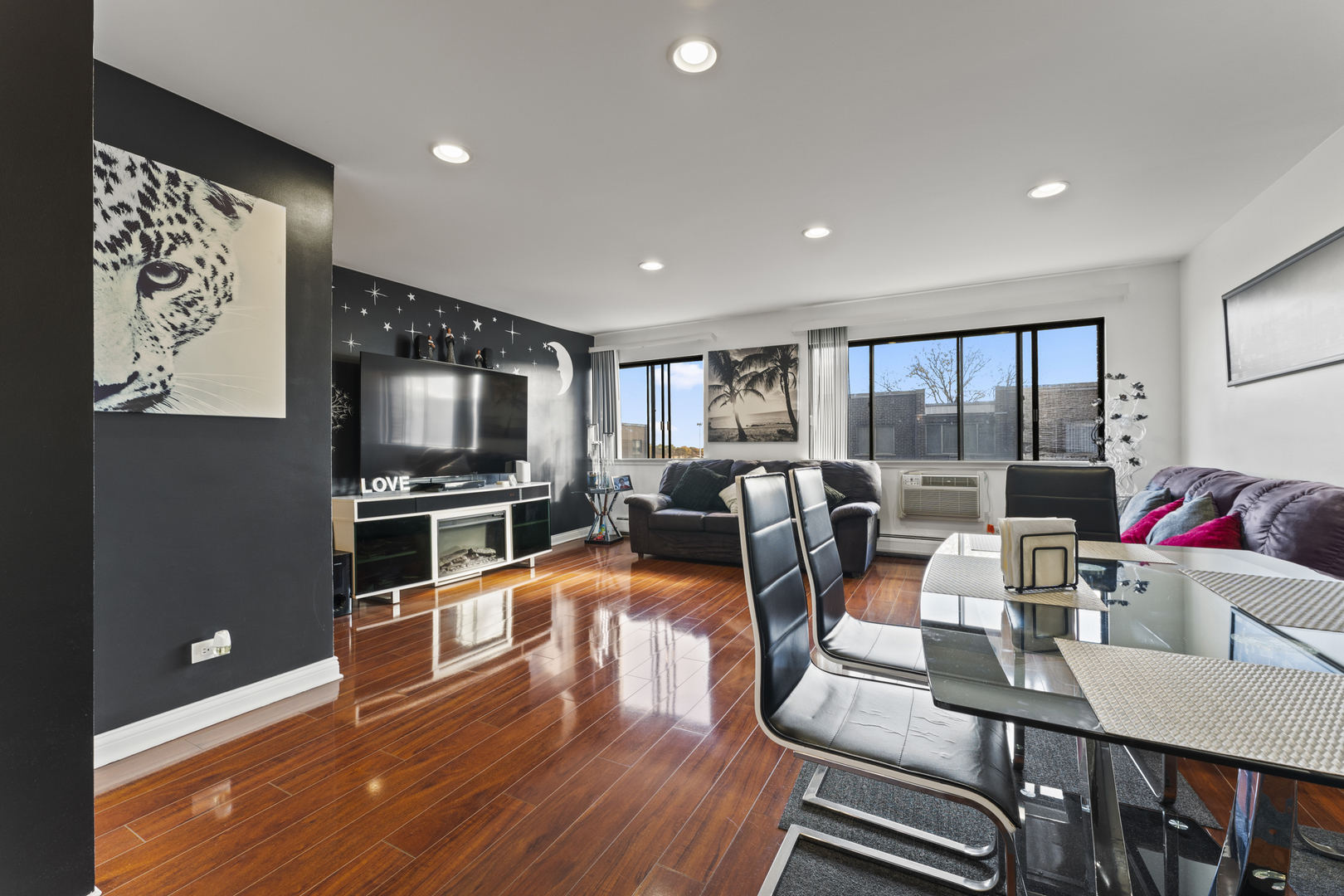 4623 North Chester Avenue, Unit 410 Chicago, IL 60656 - Photo 8 of 20 a living room with furniture and a flat screen tv