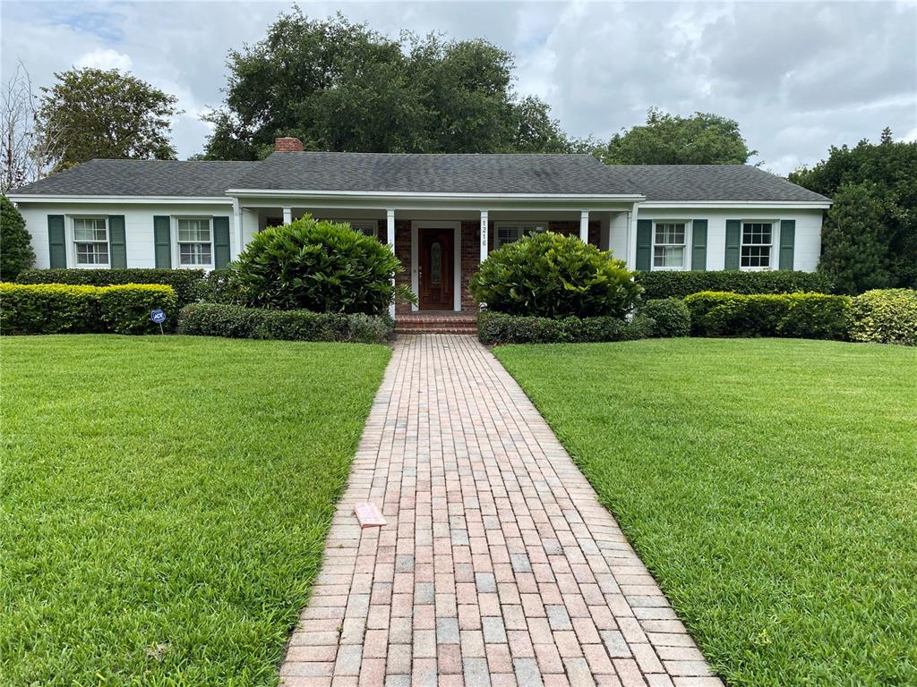 1216 Austin Road Orlando, FL 32806 - Photo 1 of 1 a front view of a house with yard