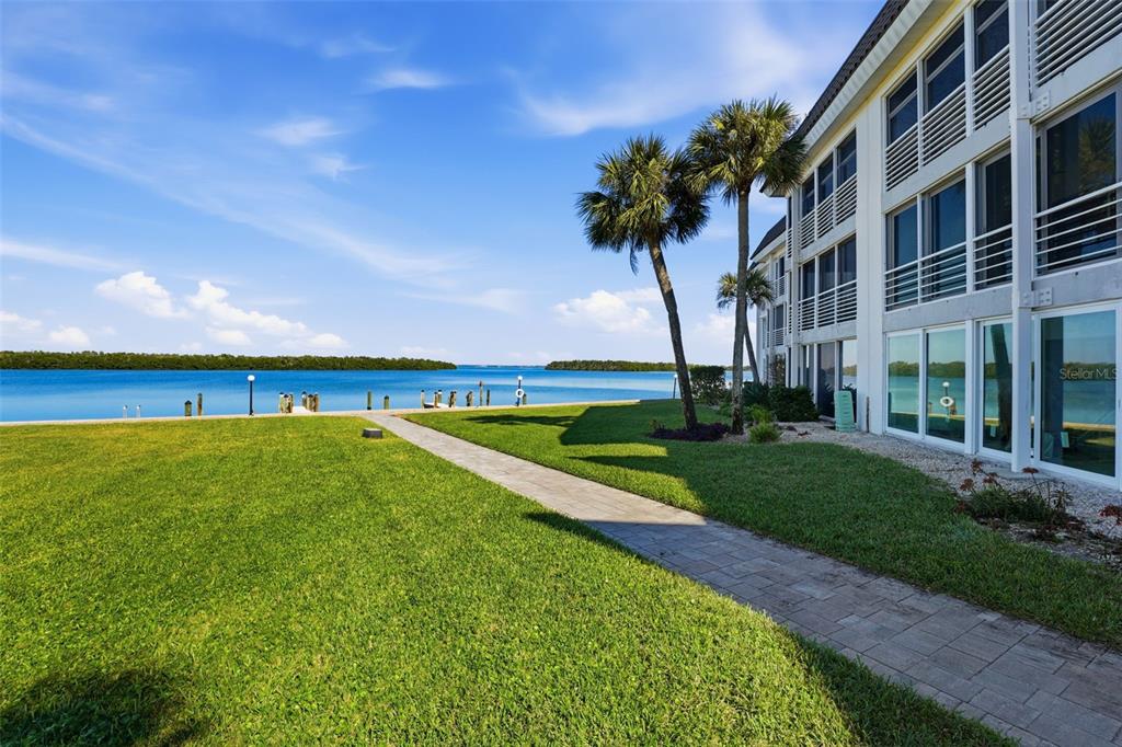 4440 Exeter Drive, Unit 106 Longboat Key, FL 34228 - Photo 19 of 26 a view of swimming pool is middle in the garden