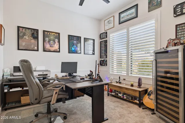 a living room with furniture a window and a flat screen tv