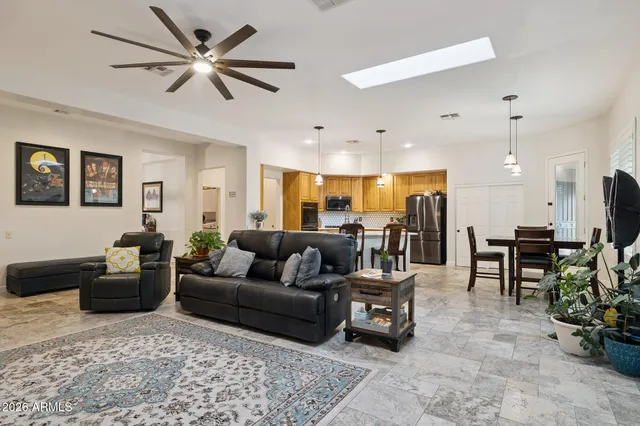 a spacious bathroom with a shower a sink and a mirror