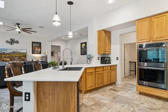 a bathroom with a double vanity sink mirror and bathtub
