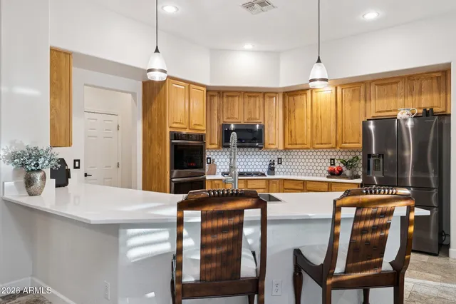 a bathroom with a bathtub sink and mirror