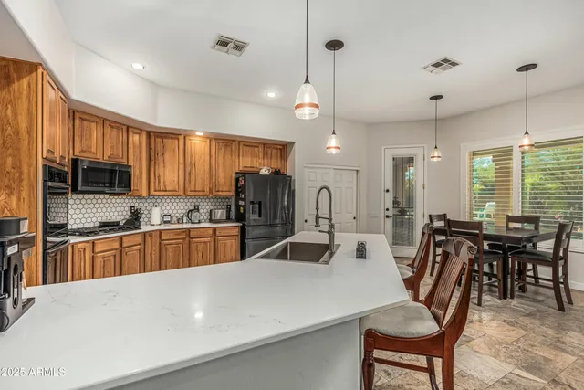 a living room with furniture and potted plant