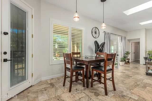 a bathroom with a granite countertop sink mirror and toilet