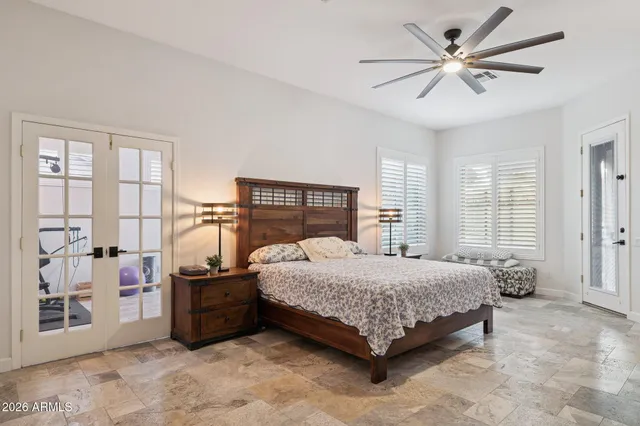 a backyard of a house with table and chairs