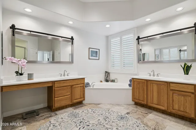 an aerial view of houses with a lake