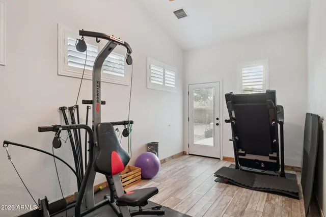 a view of a wooden bench with potted plants