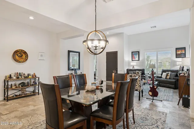 a large kitchen with kitchen island a large island in it