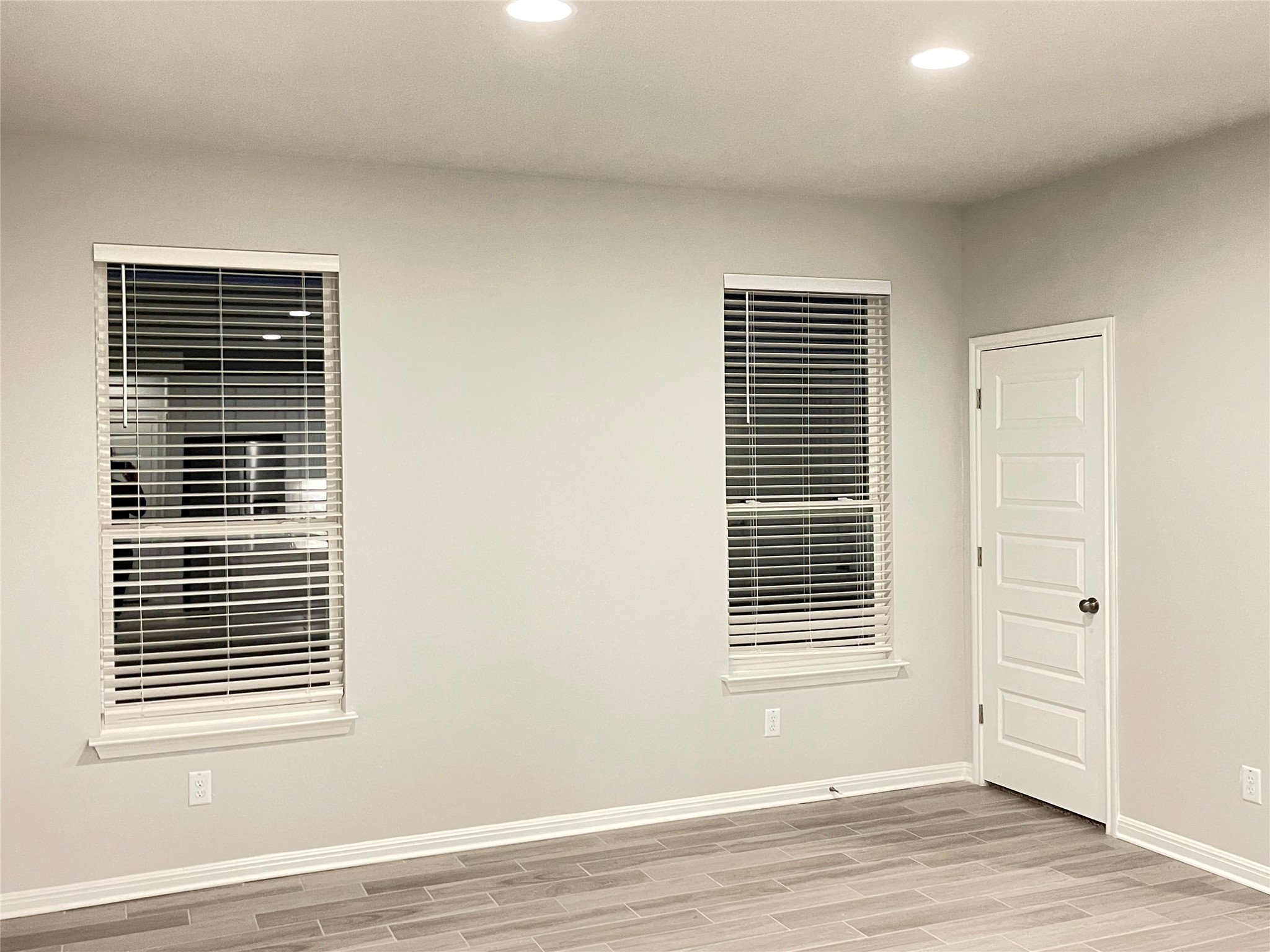 316 Mclintock Road Jarrell, TX 76537 - Photo 14 of 40 a view of an empty room with wooden floor and a window