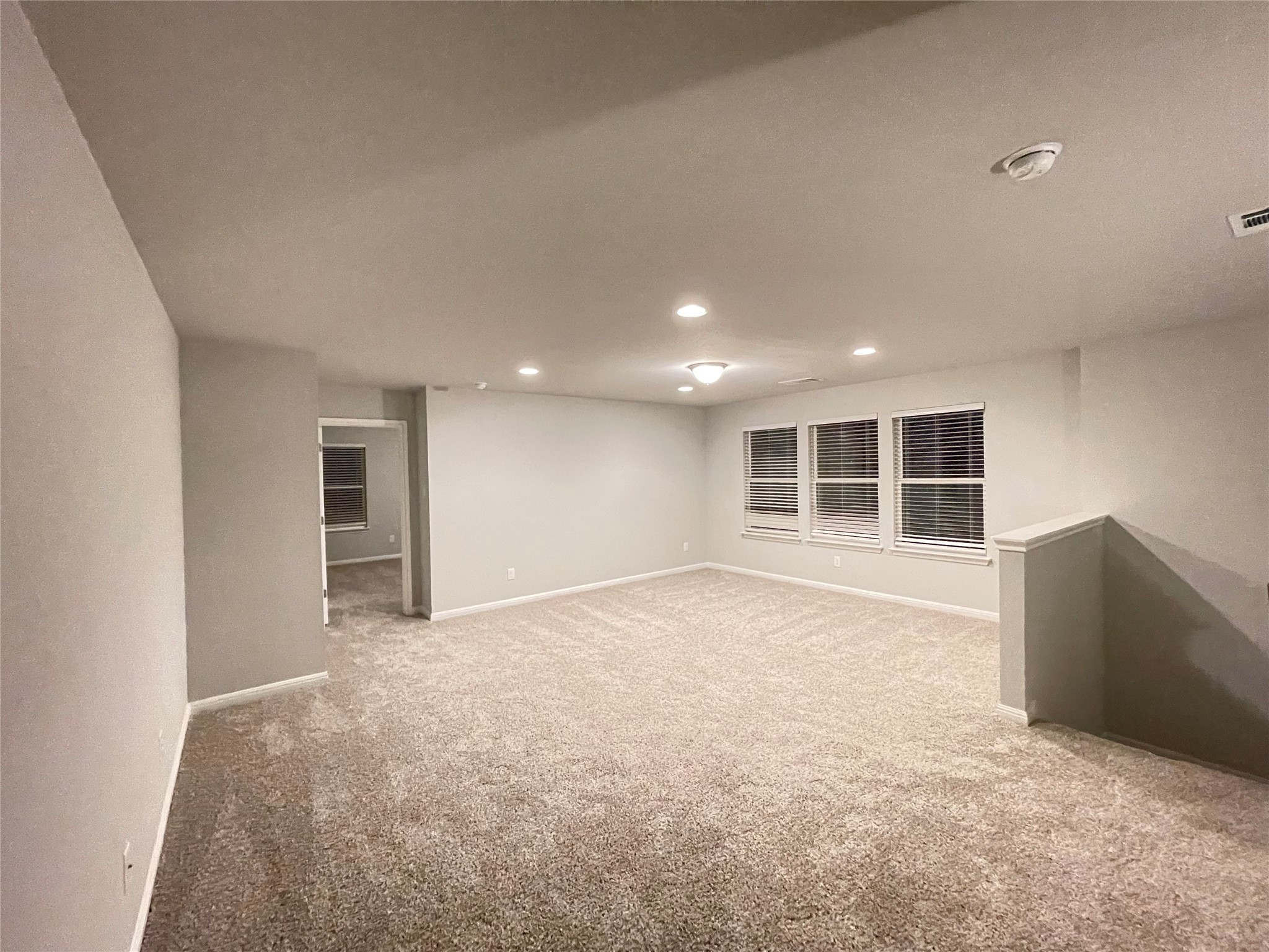 316 Mclintock Road Jarrell, TX 76537 - Photo 28 of 40 an empty room with wooden cabinet and windows