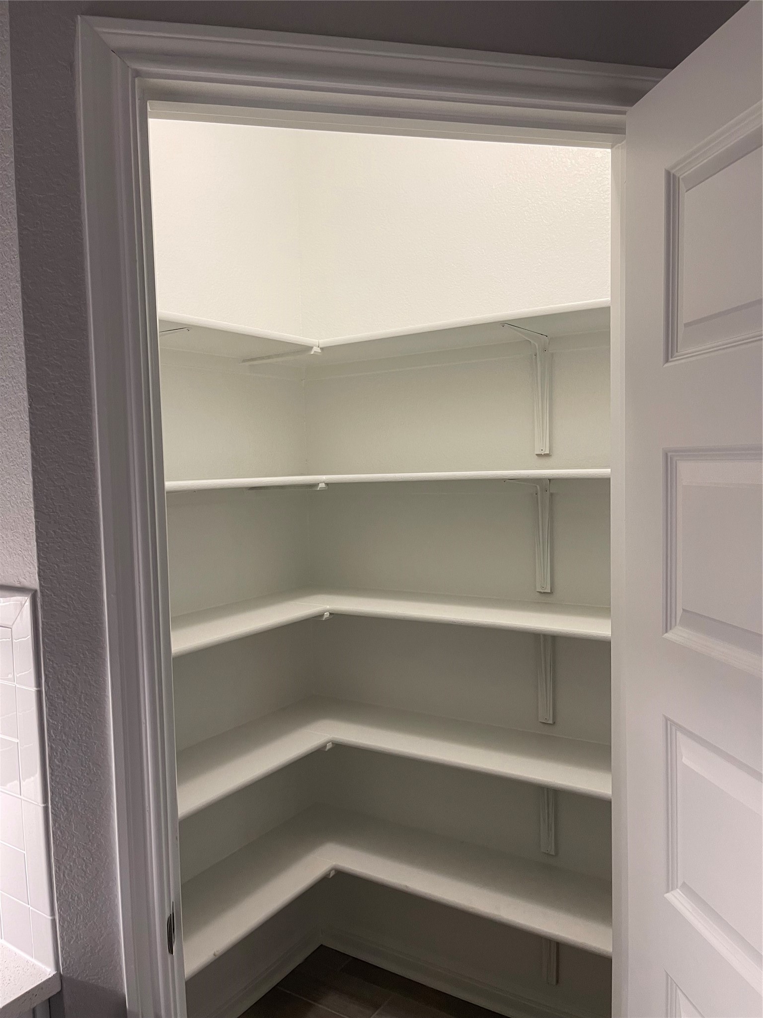 316 Mclintock Road Jarrell, TX 76537 - Photo 33 of 40 a view of walk in closet with empty racks
