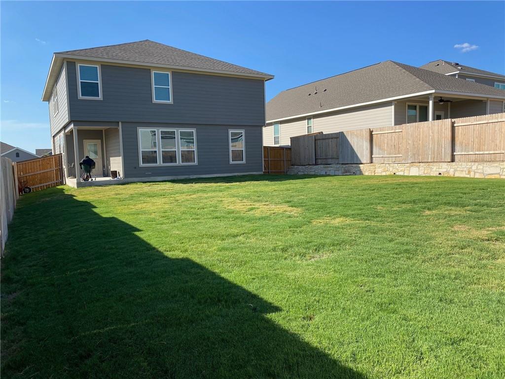 316 Mclintock Road Jarrell, TX 76537 - Photo 34 of 40 a front view of a house with a garden