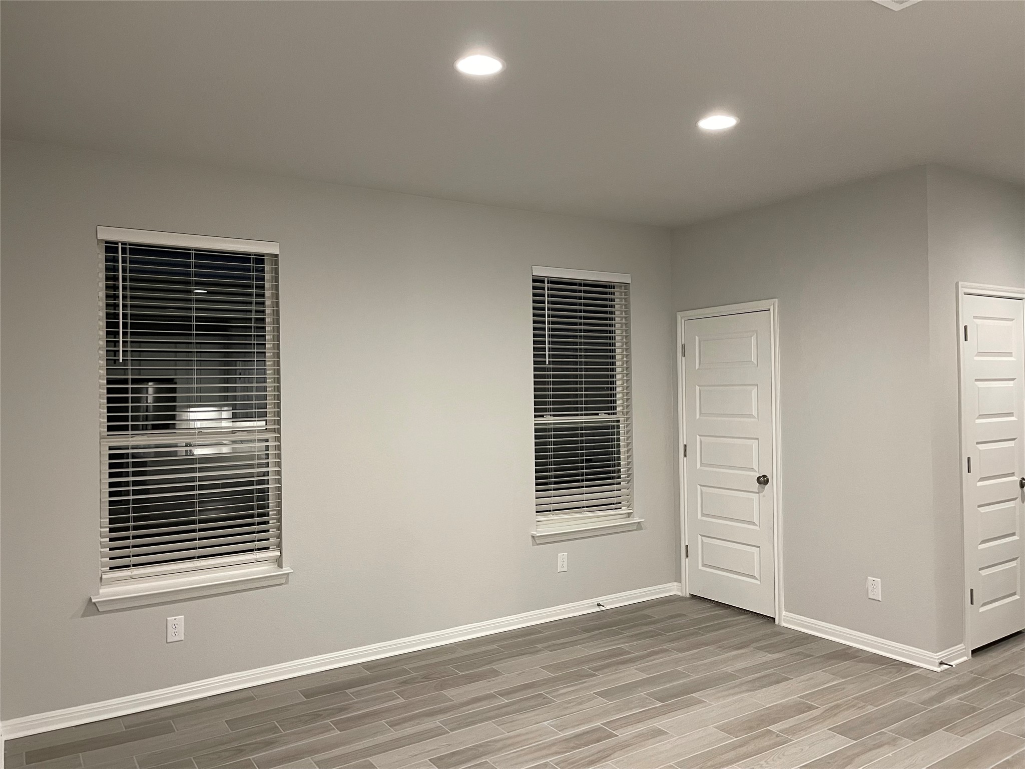 316 Mclintock Road Jarrell, TX 76537 - Photo 7 of 40 an empty room with wooden floor and windows
