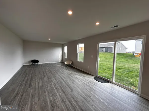 a view of livingroom with furniture and floor to ceiling window