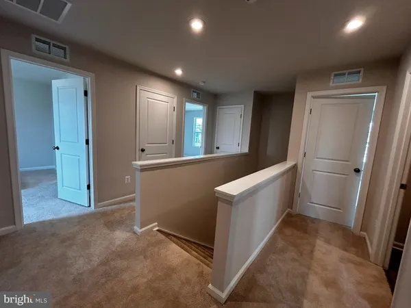 a view of a kitchen with a refrigerator