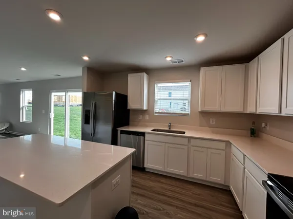 a kitchen with lots of counter space sink and appliances
