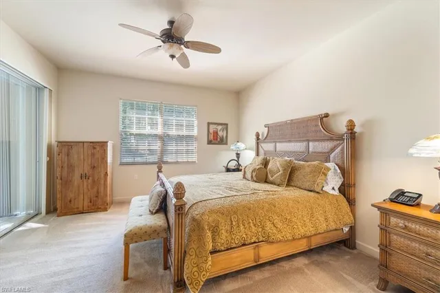 a bedroom with bed and window