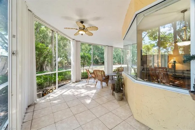 a living room with large windows