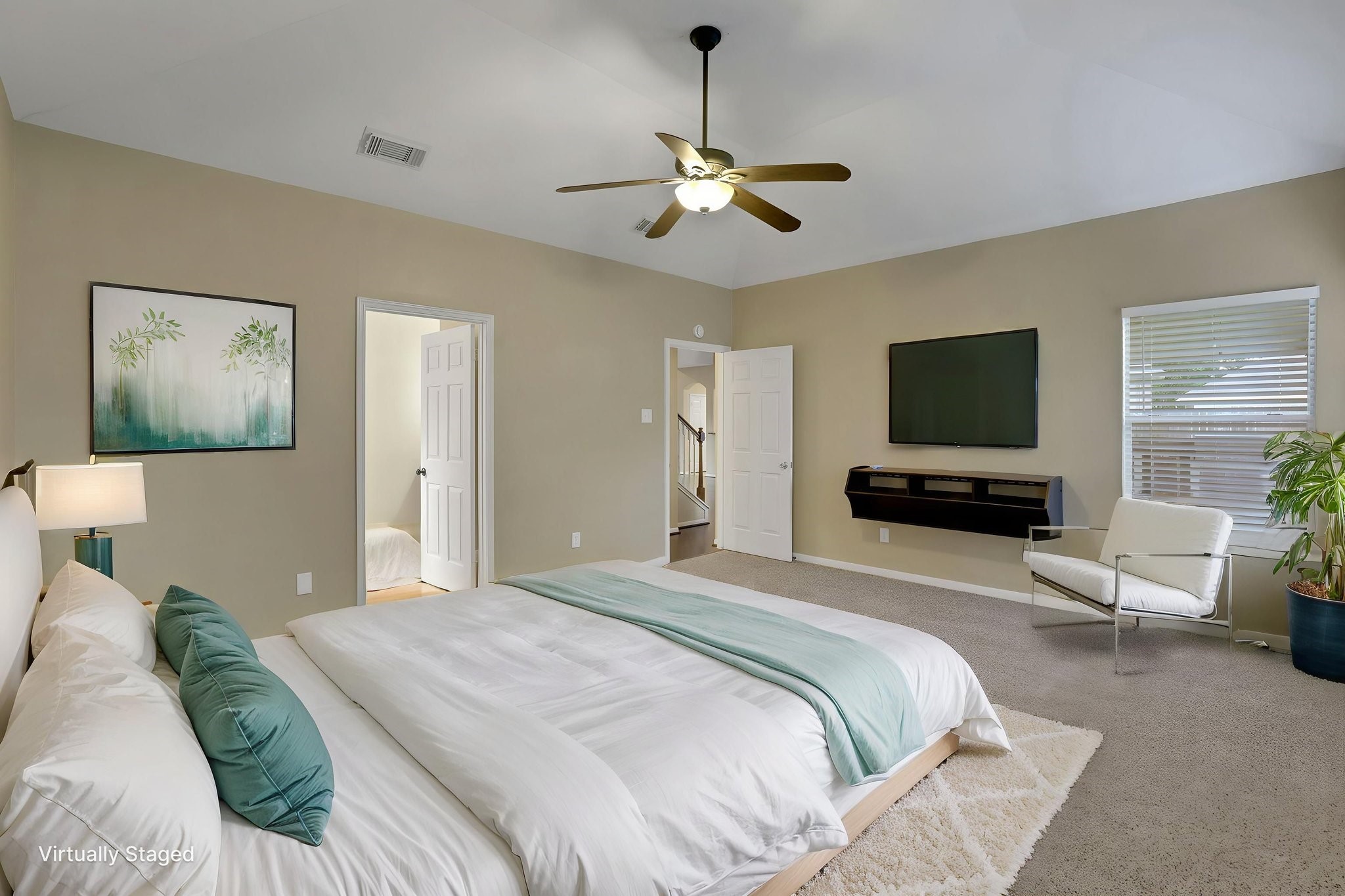 23207 Olive Ridge Court Katy, TX 77494 - Photo 21 of 46 a bedroom with a bed and a flat screen tv