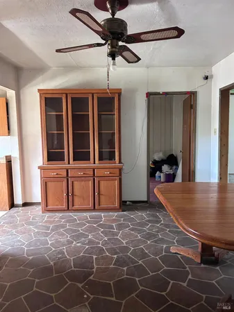 a room that has a rug and a table in it