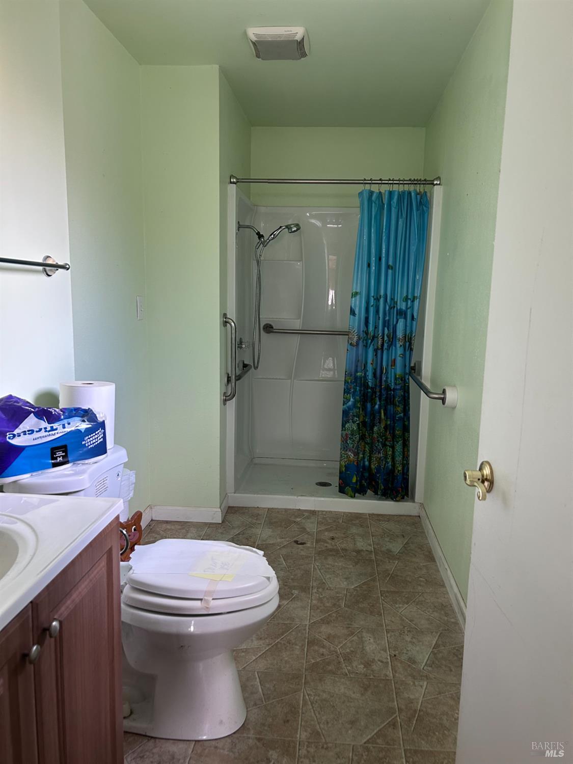 1005 Poplar Road Vacaville, CA 95687 - Photo 10 of 17 a bathroom with a sink a toilet and shower