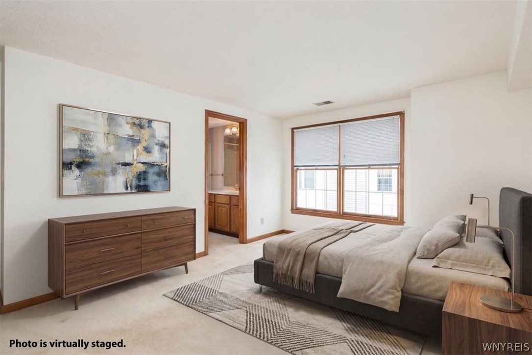 610 Youngs Road, Unit H Amherst, NY 14221 - Photo 11 of 19 Virtually Staged Primary Bedroom has lovely update