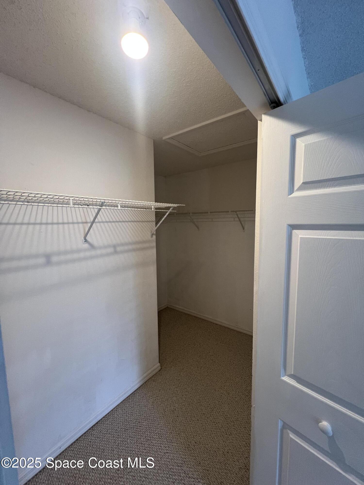 1213 Old Millpond Road Melbourne, FL 32940 - Photo 14 of 20 a view of storage and utility room with washer and dryer